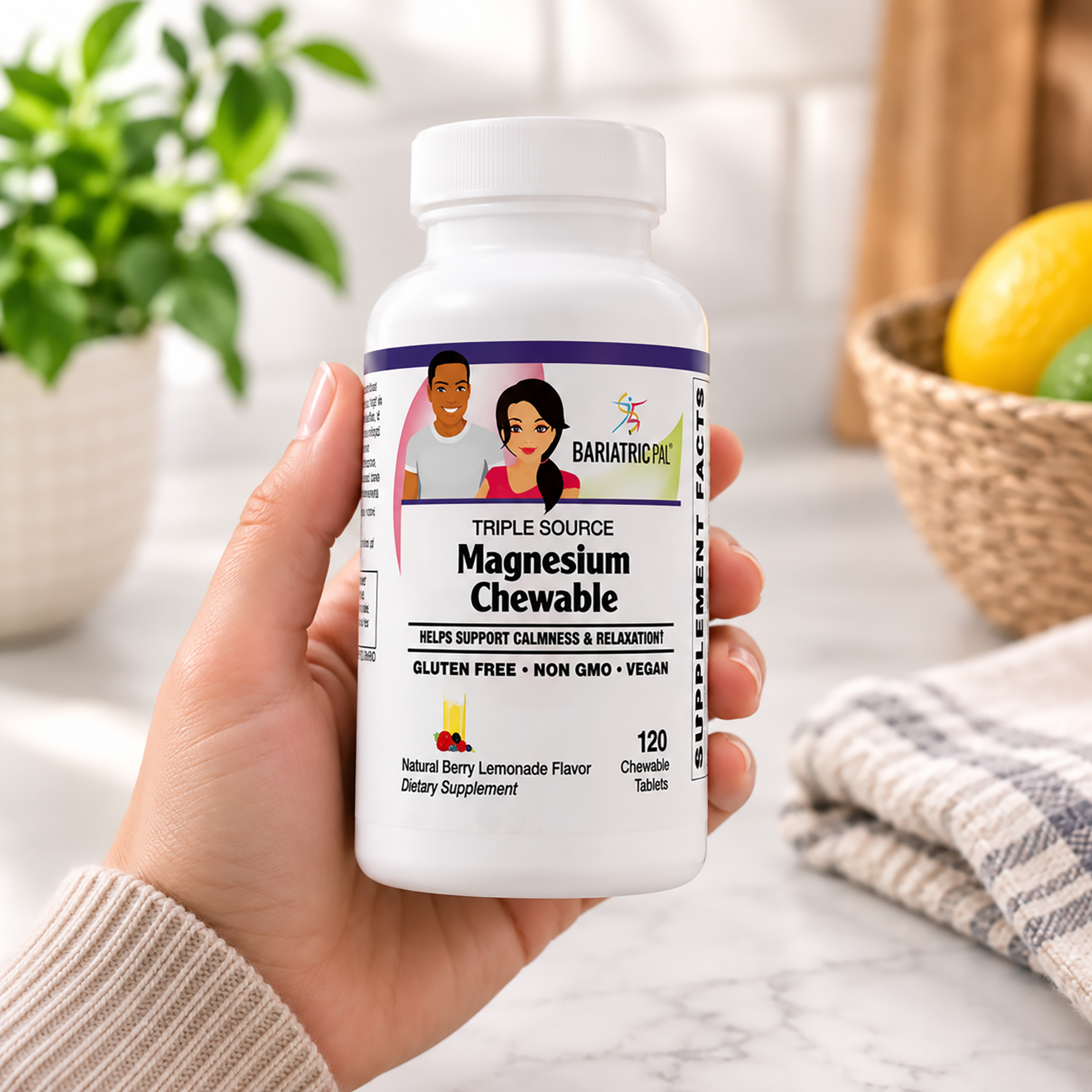 A hand holds a white bottle of BariatricPal Triple Source Magnesium Chewable tablets.
