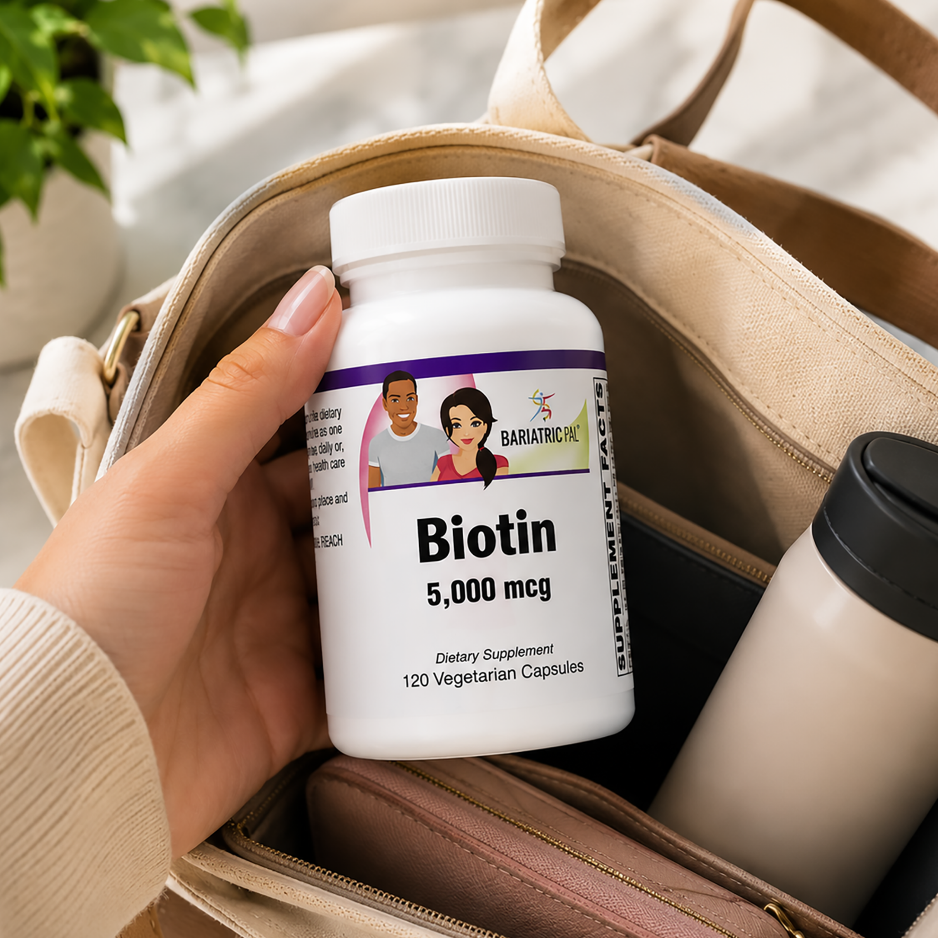 Hand holding a bottle of BariatricPal Biotin 5,000 mcg with 120 vegetarian capsules to support healthy hair, skin, nails and energy metabolism.