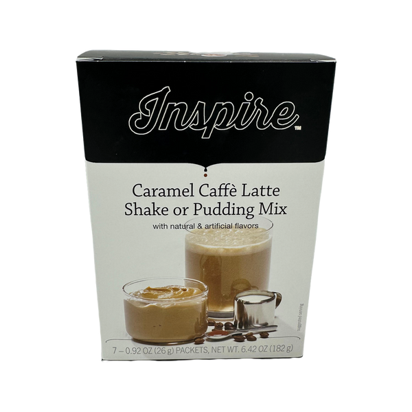 A box of Inspire Caramel Caffè Latte Shake or Pudding Mix displays two servings in glass cups, one with a creamy texture and the other topped with caramel, alongside a measuring spoon and coffee beans.