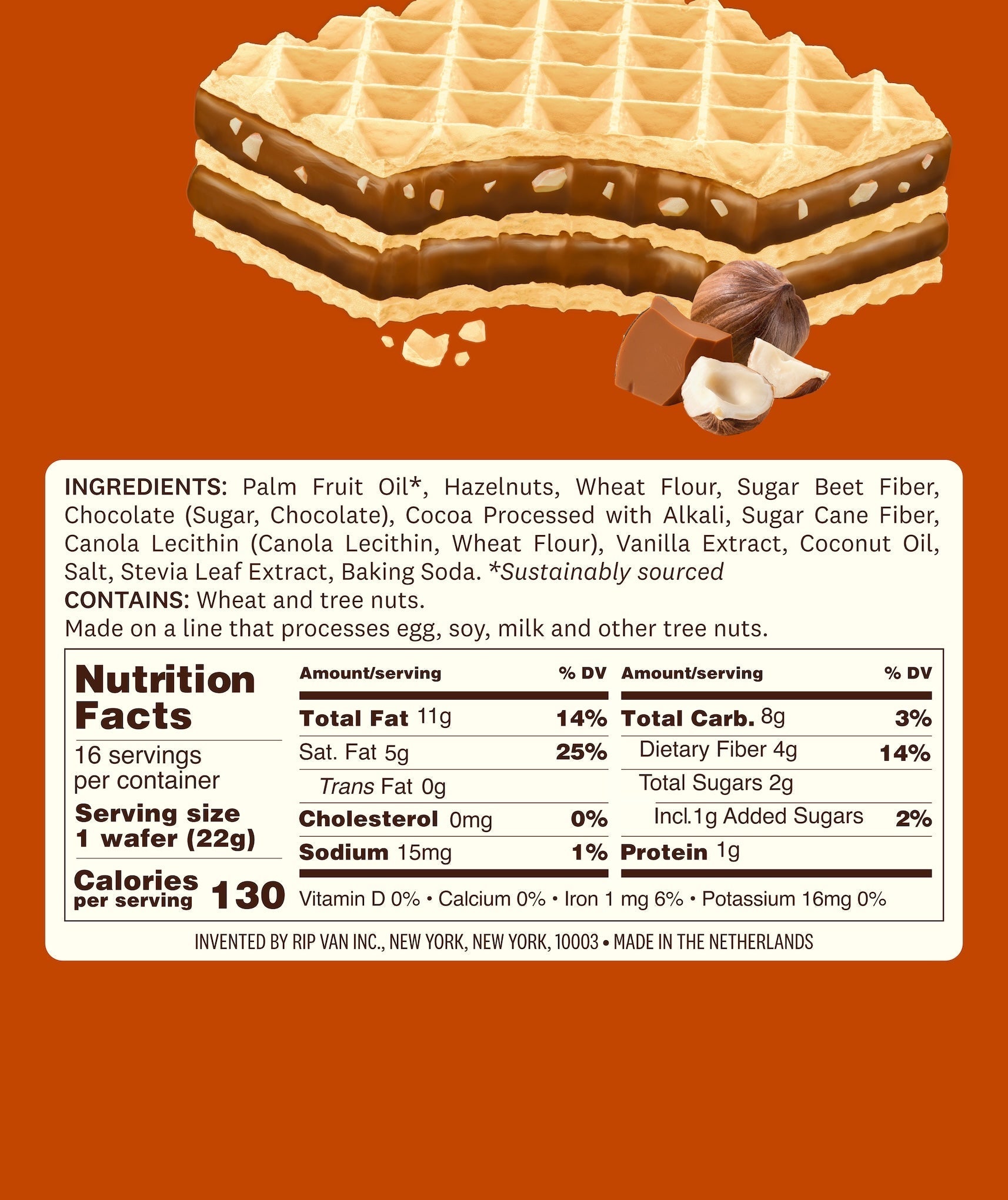 A close-up of a layered wafer filled with chocolate and hazelnut, accompanied by hazelnuts, with a nutrition facts label detailing ingredients and serving information against an orange background.