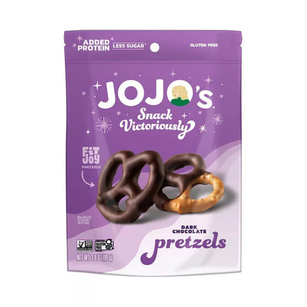 A purple snack bag labeled "JOJO's Snack Victoriously" contains dark chocolate-covered pretzels and plain pretzels, highlighting added protein and gluten-free features.