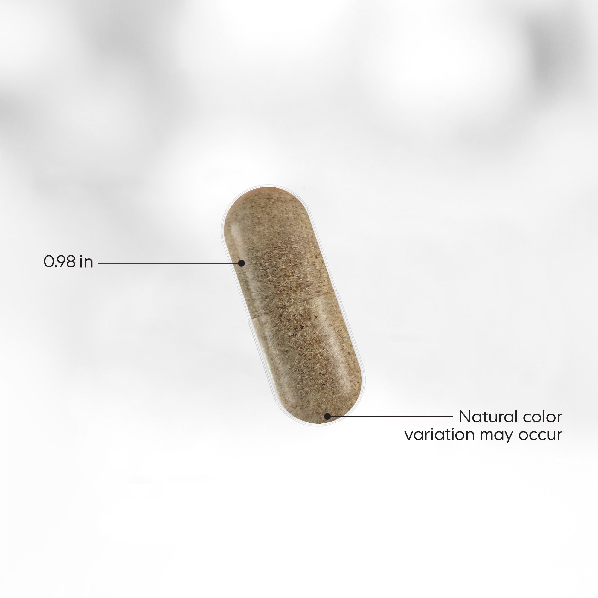 A brown capsule measuring 0.98 inches is displayed against a blurred background, with text indicating potential natural color variation.