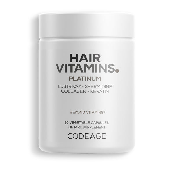 A white container labeled "HAIR VITAMINS. PLATINUM" with details about ingredients like Lustriva, Spermidine, Collagen, and Keratin, indicating it contains 90 vegetable capsules as a dietary supplement.