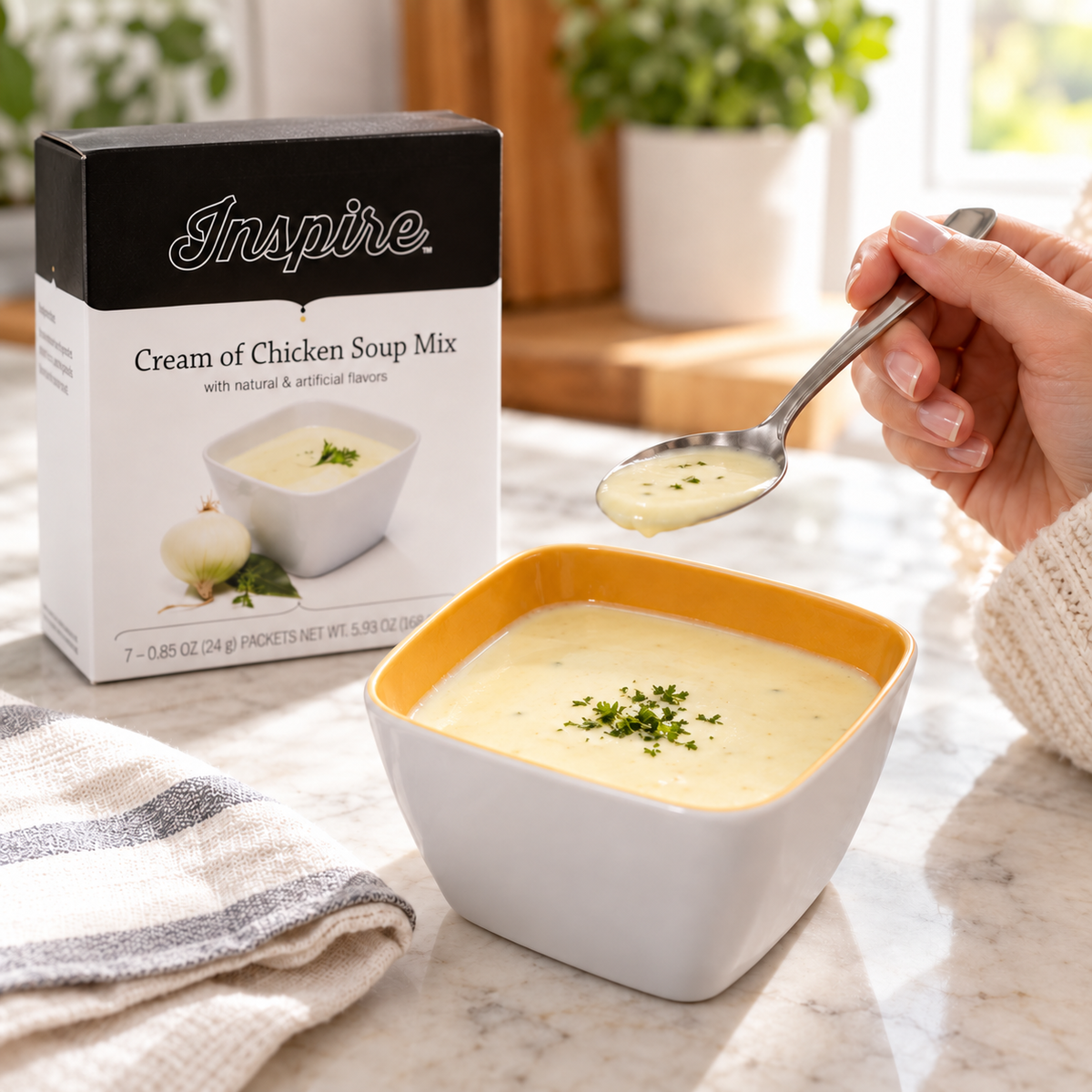 Inspire Cream of Chicken Soup Mix beside the seven-packet box. A low-carb, high-protein instant hot meal ready in minutes.