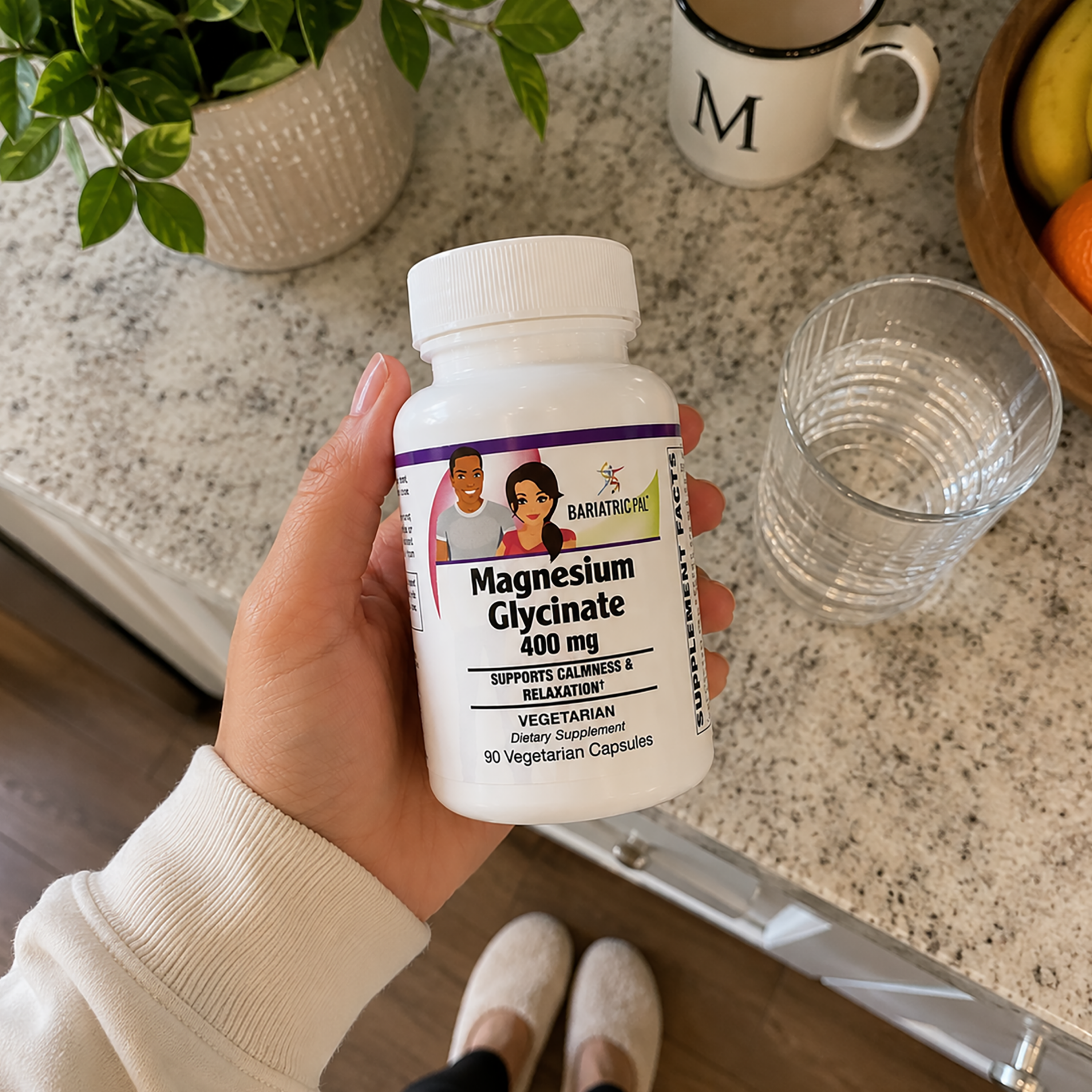 Woman holding bottle of BariatricPal Magnesium Glycinate 400 mg supports calmness, sleep quality, stress management, and healthy muscle and nerve function. One vegetarian capsule daily; 90-count bottle.