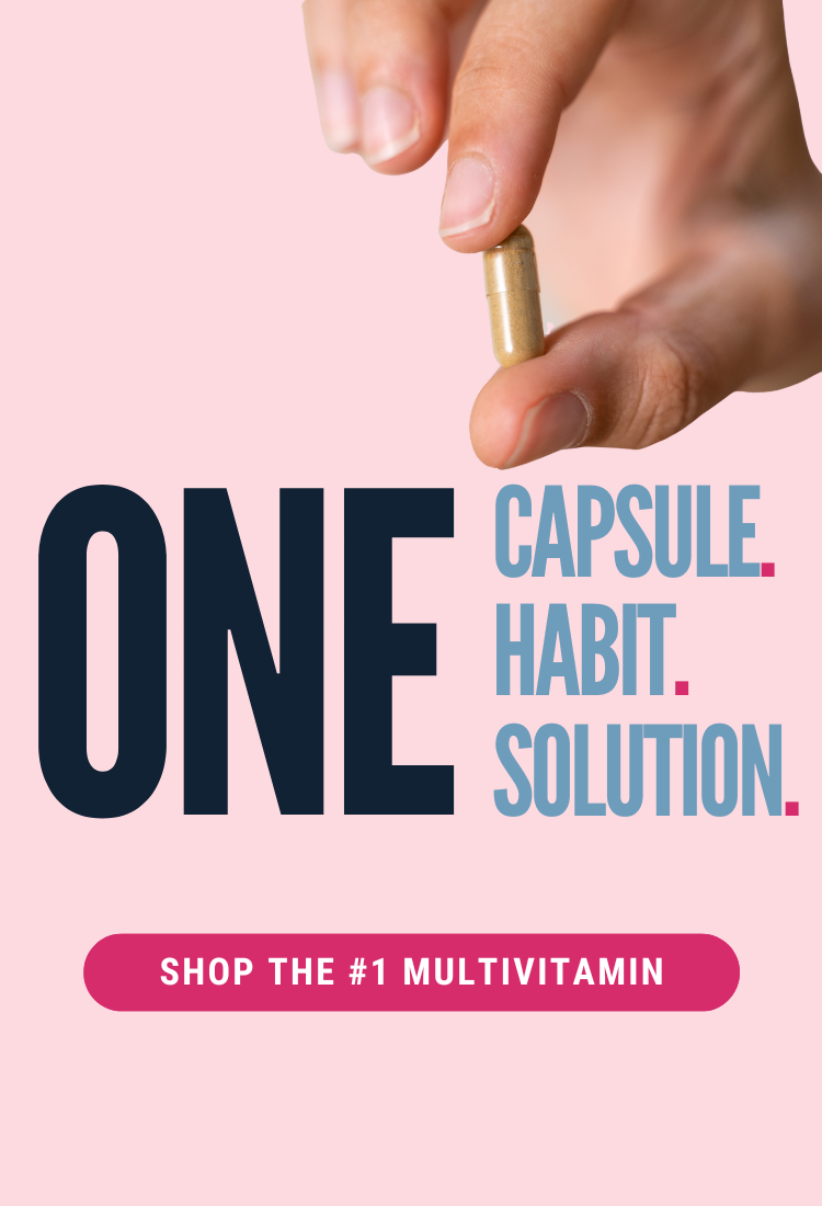 A hand holds a gold capsule against a pink background, accompanied by bold text promoting a multivitamin as a simple solution to health habits.