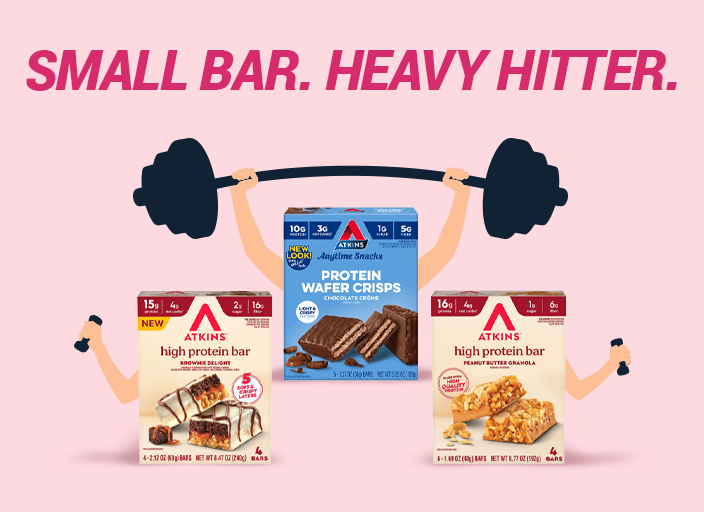 Three boxes of Atkins protein bars and wafer crisps are displayed at the center, with cartoon arms lifting a barbell above them, against a pink background featuring the text "SMALL BAR. HEAVY HITTER."