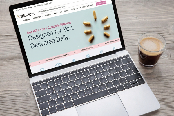Laptop displaying a health supplement website with a cup of coffee on a wooden table