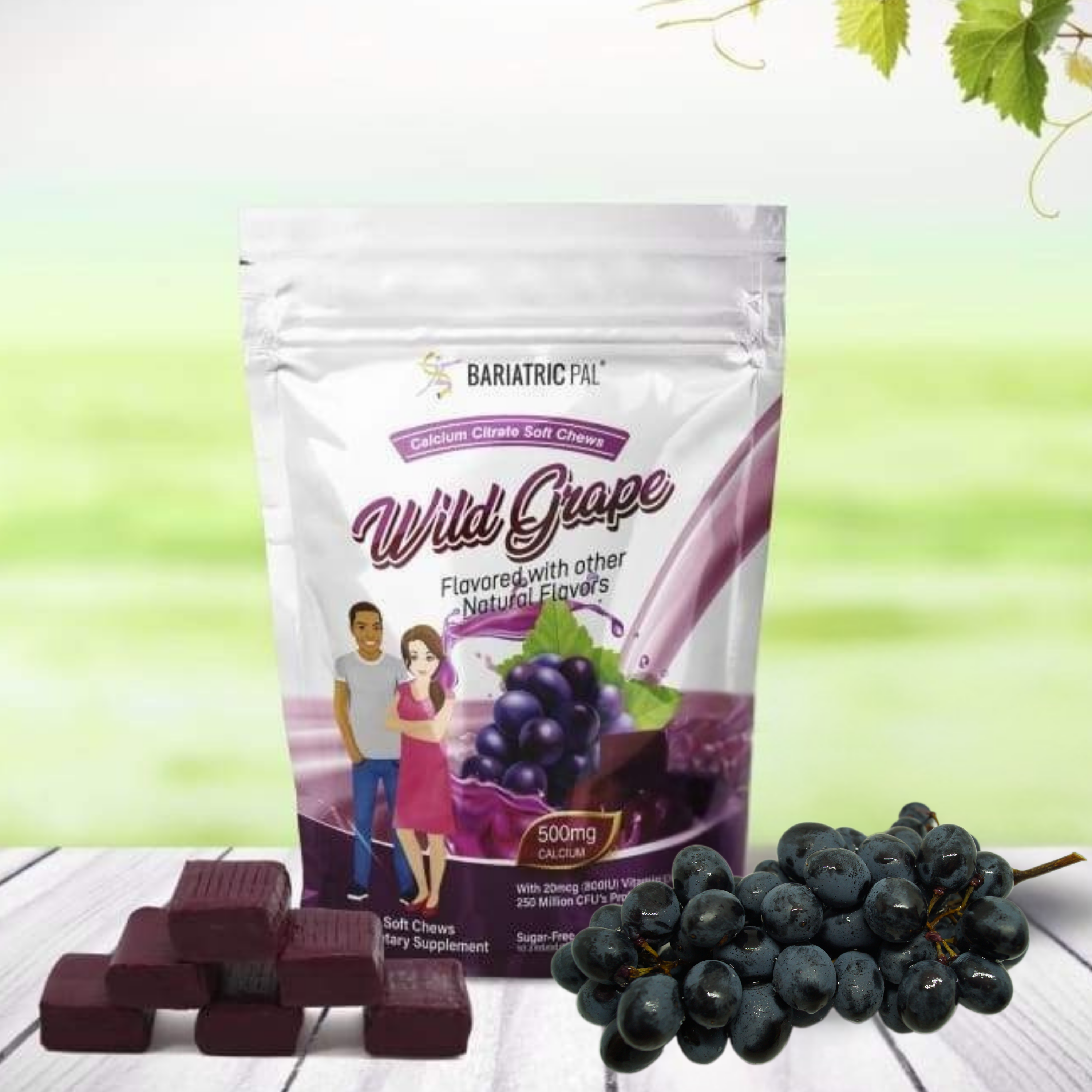 A package of Bariatric Pal Wild Grape calcium citrate soft chews is displayed alongside grape clusters and soft chew pieces on a wooden surface, set against a soft green background.