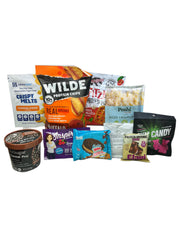 A variety of protein-rich snacks and meals are displayed, including chips, cereal, and candy, showcasing colorful packaging with brand names and nutritional highlights.