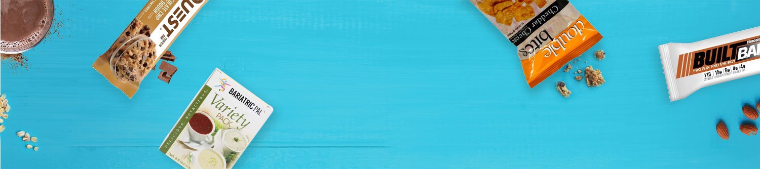 Healthy snack assortment including protein bars and mix packs on blue background