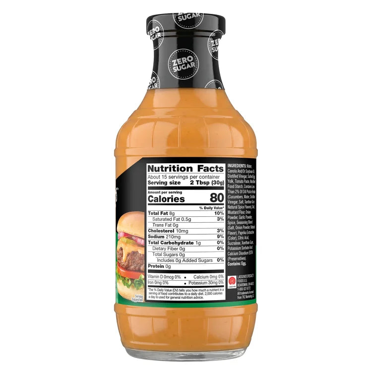 A clear bottle of zero-sugar dressing displays nutrition facts and serving information, featuring a colorful label with a burger image and details about calories and ingredients.