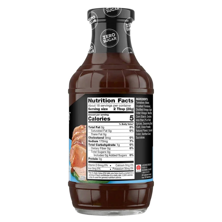 A clear bottle of zero sugar barbecue sauce displays nutrition facts, including serving size and calorie count, with a dark brown liquid and a label featuring ingredients and health information.