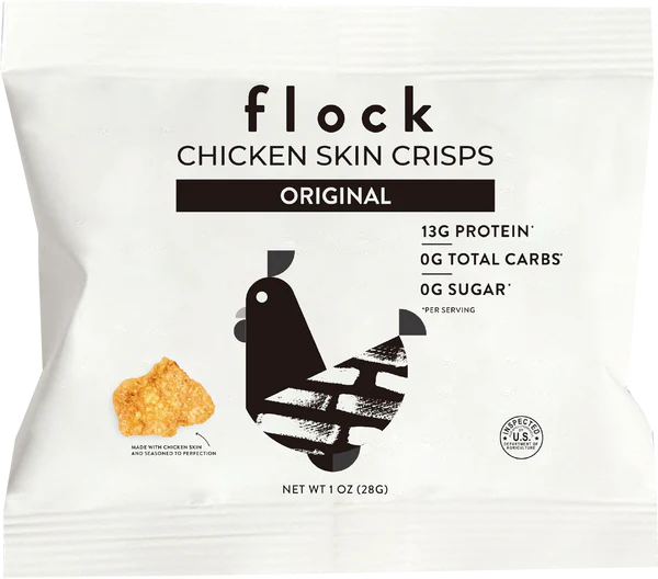 A white package labeled "flock Chicken Skin Crisps Original" features a black silhouette of a chicken and a crispy snack piece, highlighting nutritional information including 13g protein and 0g sugar per serving.