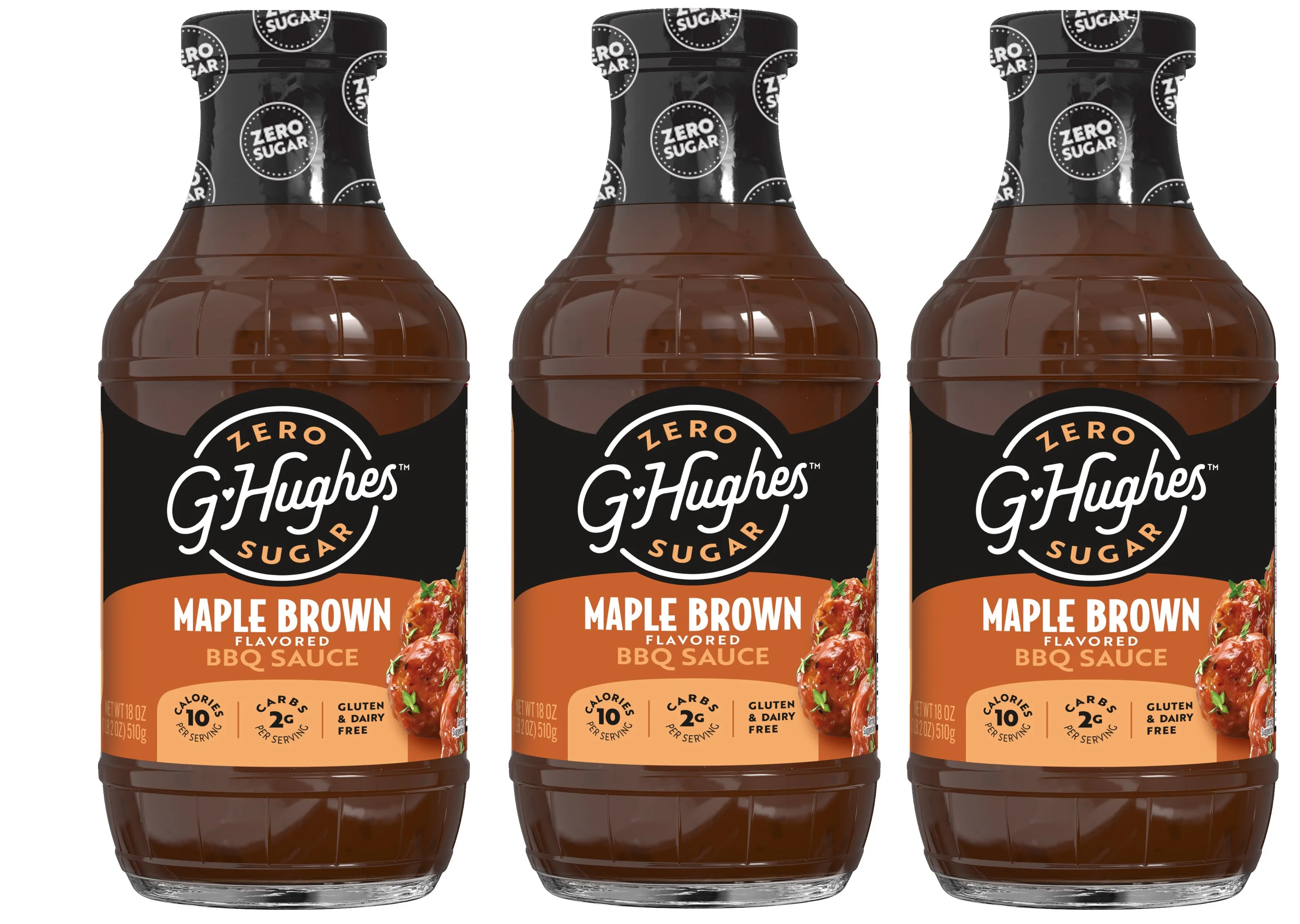 Three bottles of G. Hughes Maple Brown flavored BBQ sauce are displayed, featuring a dark brown liquid, a black and orange label, and information highlighting it as zero sugar, gluten-free, and low-calorie.
