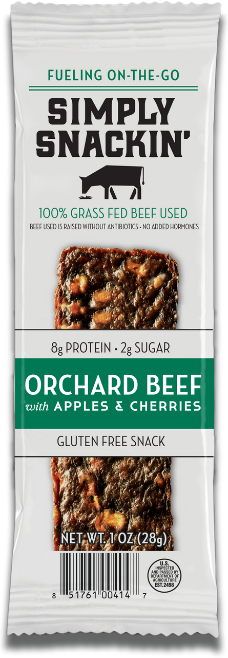 A packaged snack bar labeled "Simply Snackin' Orchard Beef with Apples & Cherries," featuring 8g of protein, 2g of sugar, and gluten-free, with a cow graphic and nutrition details on the front.