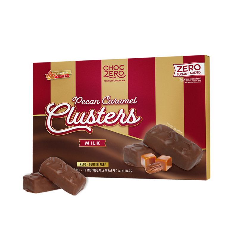 A box of ChocZero Pecan Caramel Clusters features milk chocolate bars with visible caramel and pecan filling, labeled as gluten-free, keto-friendly, and containing zero sugar added.