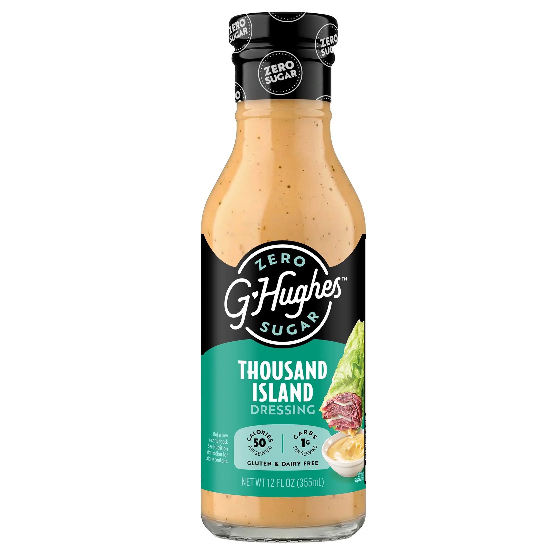 A clear bottle of G. Hughes Zero Sugar Thousand Island Dressing, featuring a creamy orange sauce, with labels highlighting it is gluten and dairy-free, and contains 50 calories per serving.